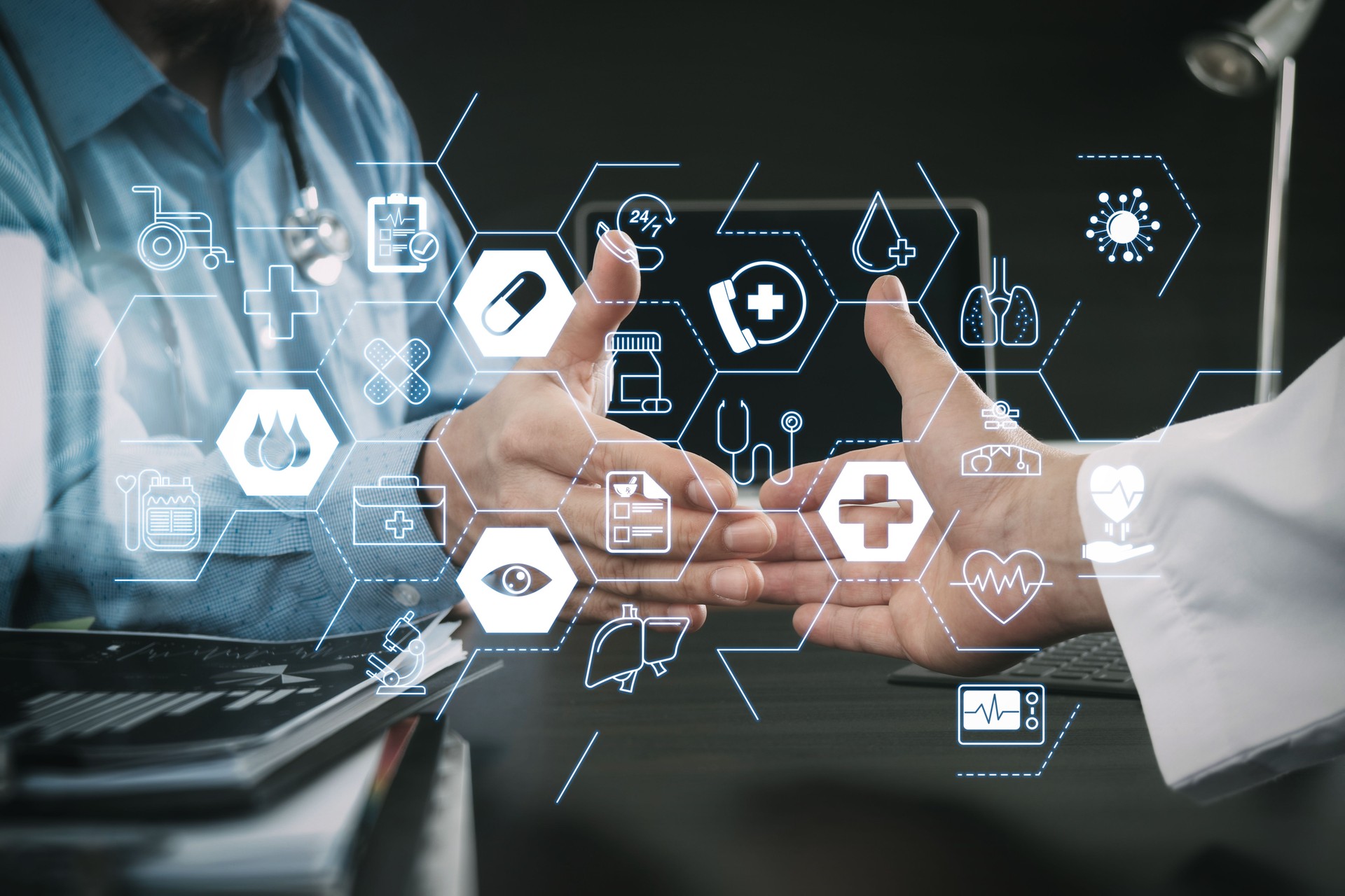 Medical and health care concept,Doctor and patient shaking hands in modern office at hospital